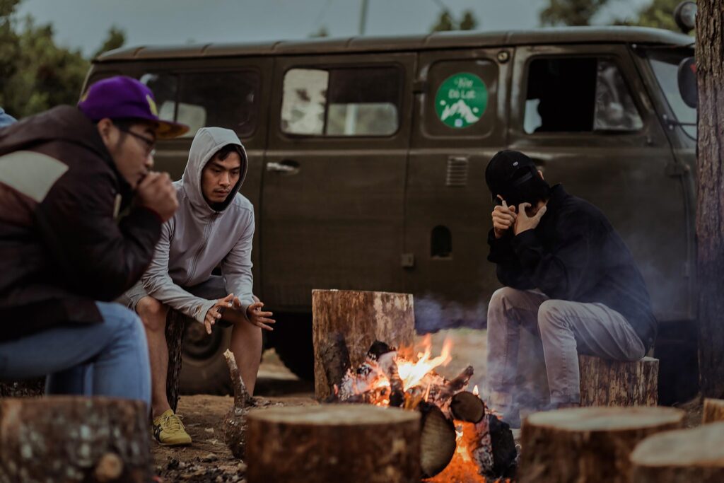 Accountability in faith illustrated by a group of men sitting together around a campfire, symbolizing Christian brotherhood, honest conversation, and spiritual growth through community.